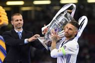 CARDIFF, WALES - JUNE 03:  Sergio Ramos of Real Madrid collects the trophy from UEFA President Aleksander Ceferin after the UEFA Champions League Final between Juventus and Real Madrid at National Stadium of Wales on June 3, 2017 in Cardiff, Wales.  (Photo by Matthias Hangst/Getty Images)